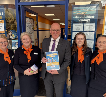 Scotland’s First Minister visits travel agency to show support for fundraising